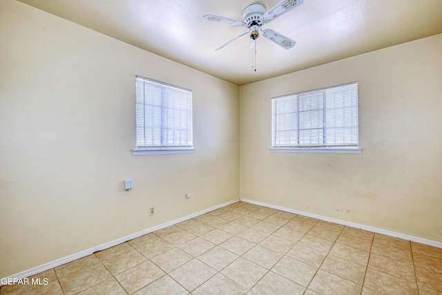 4209 Hercules Ave, El Paso, TX 79904 - unfurnished room featuring a ceiling fan, light tile patterned floors, and baseboards