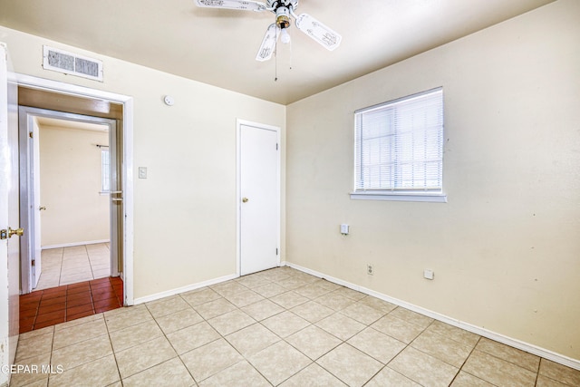4209 Hercules Ave, El Paso, TX 79904 - unfurnished bedroom with light tile patterned floors, baseboards, and ceiling fan