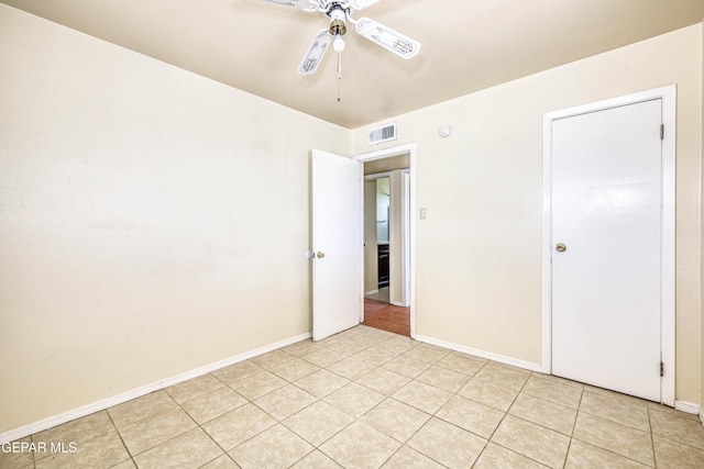 4209 Hercules Ave, El Paso, TX 79904 - unfurnished bedroom with baseboards, ceiling fan, and light tile patterned flooring
