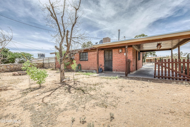 4209 Hercules Ave, El Paso, TX 79904 - back of property featuring fence and brick siding