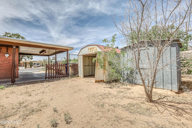 4209 Hercules Ave, El Paso, TX 79904 - view of yard featuring a storage unit, an outdoor structure, and fence