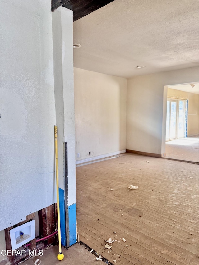 4500 Frankfort Ave, El Paso, TX 79903 - spare room with wood-type flooring and baseboards