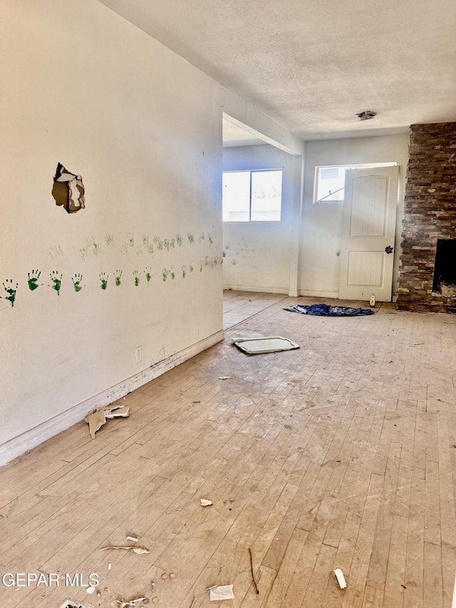 4500 Frankfort Ave, El Paso, TX 79903 - unfurnished living room with hardwood / wood-style floors
