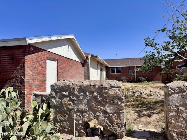 4500 Frankfort Ave, El Paso, TX 79903 - view of side of property with an attached garage and brick siding