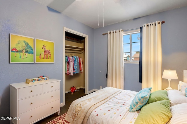 5713 Sanders Ave, El Paso, TX 79924 - bedroom with dark wood-style flooring, baseboards, and a closet