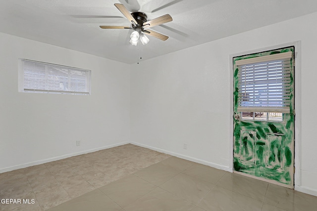 5713 Sanders Ave, El Paso, TX 79924 - unfurnished room with a ceiling fan, baseboards, and light tile patterned flooring