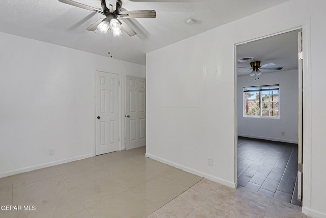 5713 Sanders Ave, El Paso, TX 79924 - spare room featuring ceiling fan, light tile patterned floors, baseboards, and a smoke detector