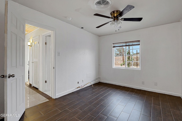 5713 Sanders Ave, El Paso, TX 79924 - spare room with dark wood finished floors, a ceiling fan, baseboards, and a smoke detector