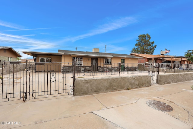 5713 Sanders Ave, El Paso, TX 79924 - ranch-style house with a fenced front yard, stucco siding, and a gate