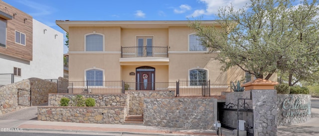 5536 Ventana Del Sol Dr, El Paso, TX 79912 - view of front of home with a balcony, stucco siding, and french doors