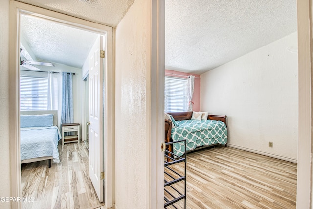 5137 Edmonton Ave, El Paso, TX 79924 - bedroom with a textured ceiling and wood finished floors
