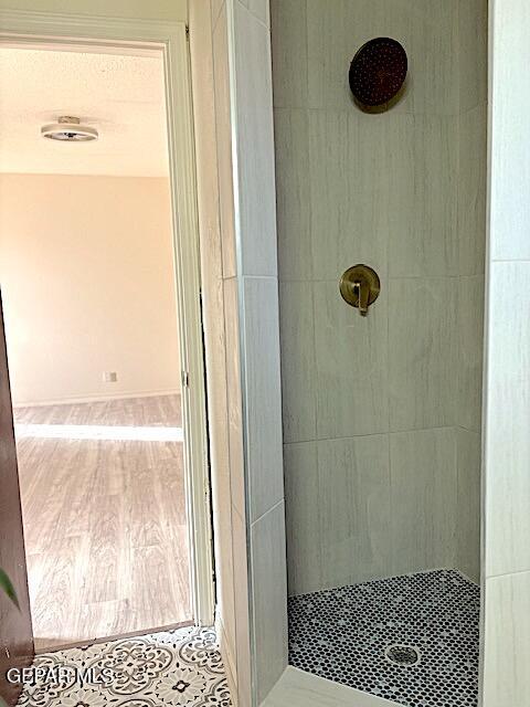 bathroom featuring tiled shower