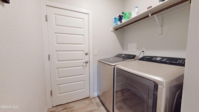 569 Logwood Ave, Canutillo, TX 79835 - laundry area with washer and clothes dryer, baseboards, and light marble finish floors