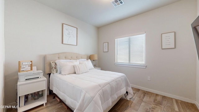 569 Logwood Ave, Canutillo, TX 79835 - bedroom with wood finished floors and baseboards