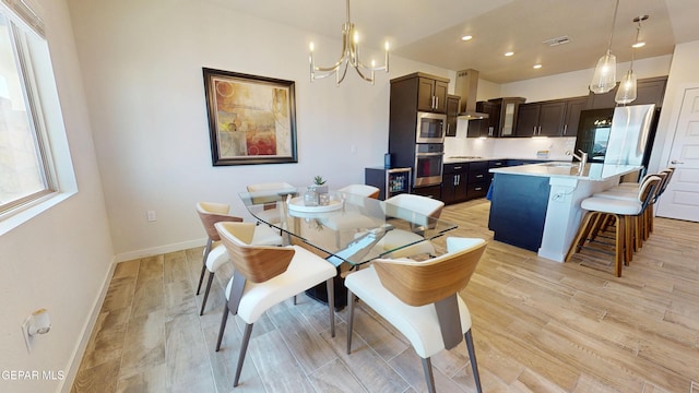 569 Logwood Ave, Canutillo, TX 79835 - dining area featuring baseboards, a chandelier, light wood-style flooring, and recessed lighting