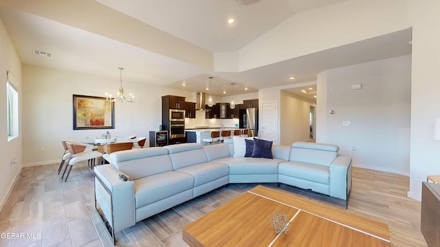 569 Logwood Ave, Canutillo, TX 79835 - living room with a chandelier, baseboards, vaulted ceiling, recessed lighting, and light wood-type flooring
