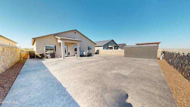 569 Logwood Ave, Canutillo, TX 79835 - view of front of property with a fenced backyard, stucco siding, and a patio