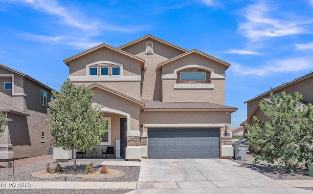 14809 Tierra Escape Ave, El Paso, TX 79938 - view of front of home featuring stucco siding, a garage, and concrete driveway