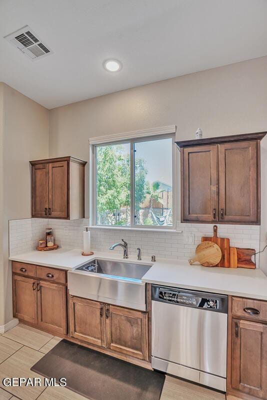 14809 Tierra Escape Ave, El Paso, TX 79938 - kitchen with dishwasher, tasteful backsplash, light countertops, and a sink