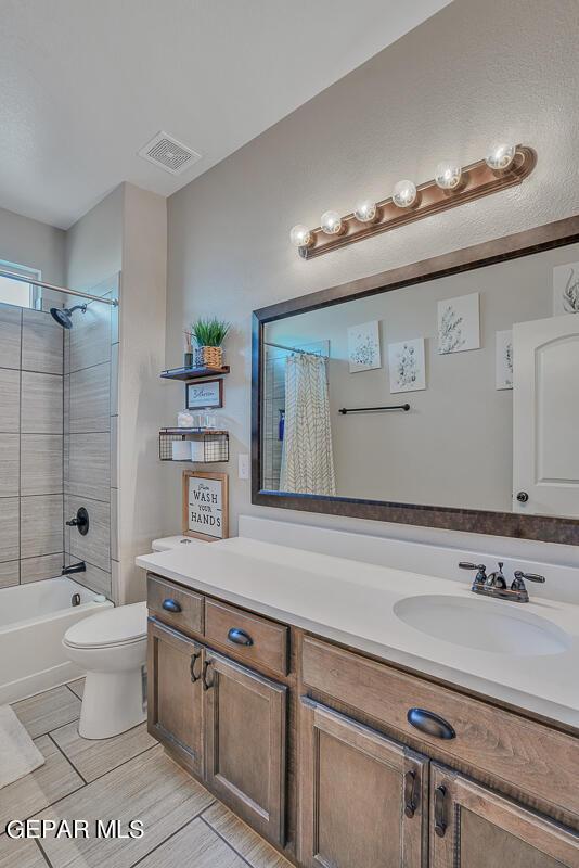 14809 Tierra Escape Ave, El Paso, TX 79938 - bathroom featuring toilet, vanity, and shower / bath combo