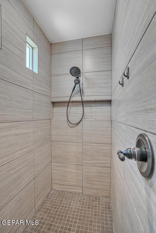 14809 Tierra Escape Ave, El Paso, TX 79938 - bathroom featuring a tile shower