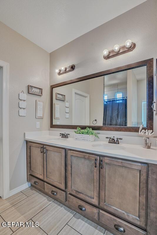 14809 Tierra Escape Ave, El Paso, TX 79938 - bathroom featuring double vanity and wood finished floors