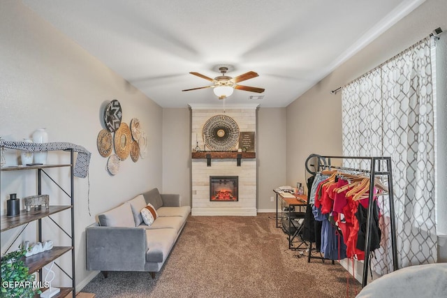 14809 Tierra Escape Ave, El Paso, TX 79938 - carpeted living room with a fireplace, a ceiling fan, and baseboards