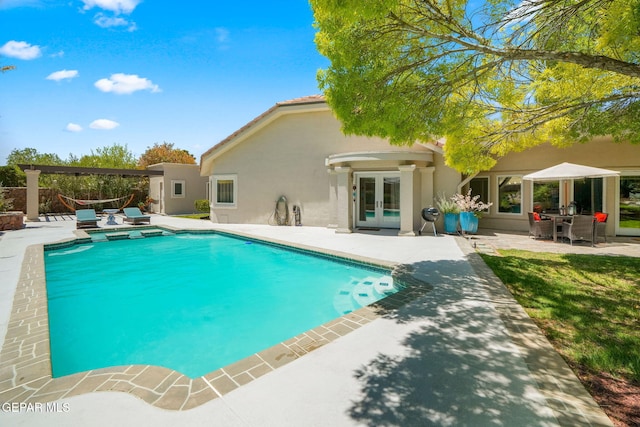 12081 E Paseo De Amor Ln E, El Paso, TX 79936 - swimming pool with french doors and a patio