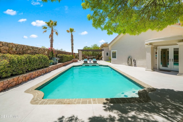 12081 E Paseo De Amor Ln E, El Paso, TX 79936 - view of swimming pool with french doors, a patio, and a fenced backyard