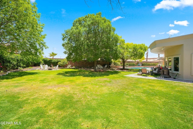 12081 E Paseo De Amor Ln E, El Paso, TX 79936 - view of grassy yard featuring a patio area