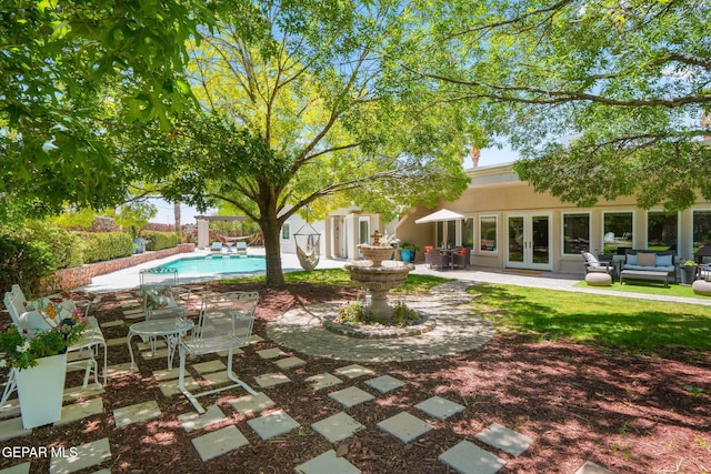 12081 E Paseo De Amor Ln E, El Paso, TX 79936 - view of pool featuring french doors, a patio, and an outdoor living space