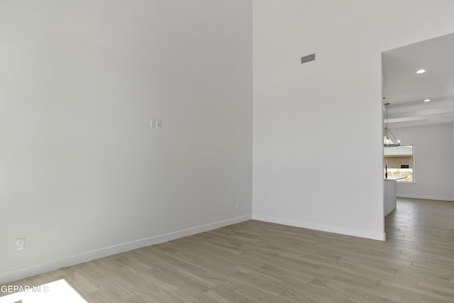 10700 Elise St, El Paso, TX 79924 - empty room featuring light wood-type flooring, recessed lighting, and baseboards