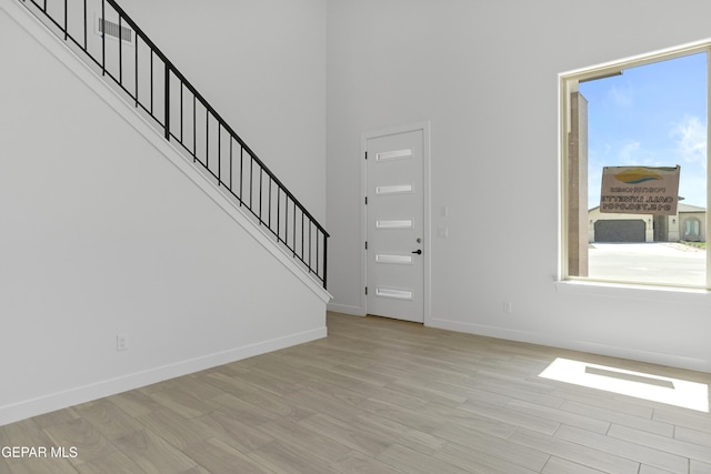 10700 Elise St, El Paso, TX 79924 - foyer featuring wood finished floors, stairway, and baseboards