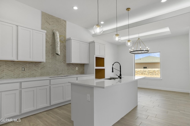 10700 Elise St, El Paso, TX 79924 - kitchen featuring a sink, an island with sink, recessed lighting, light countertops, and a chandelier
