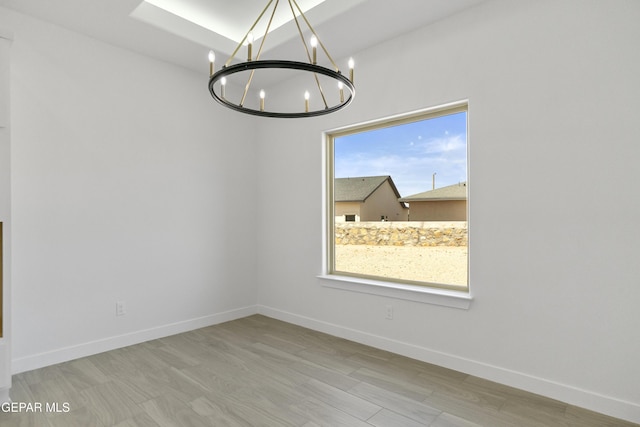 10700 Elise St, El Paso, TX 79924 - unfurnished room with a chandelier and baseboards