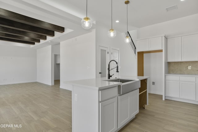 10700 Elise St, El Paso, TX 79924 - kitchen with a sink, light countertops, tasteful backsplash, recessed lighting, and white cabinetry