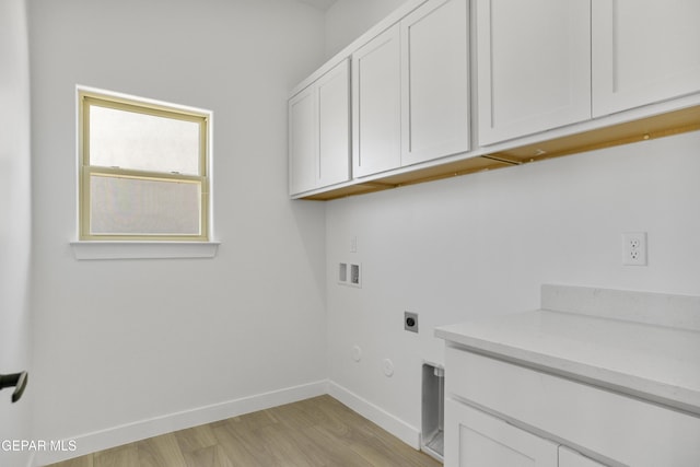 10700 Elise St, El Paso, TX 79924 - washroom with gas dryer hookup, hookup for an electric dryer, baseboards, light wood finished floors, and washer hookup
