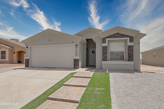 13804 Flora Vista Ave, Horizon City, TX 79928 - ranch-style house featuring stone siding, an attached garage, concrete driveway, and stucco siding