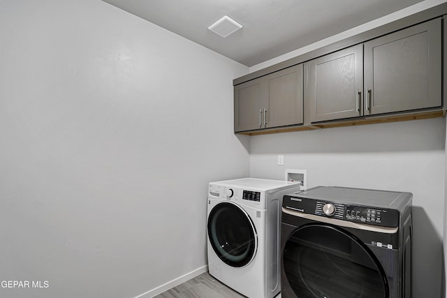 13804 Flora Vista Ave, Horizon City, TX 79928 - laundry room with cabinet space, washer and clothes dryer, and baseboards