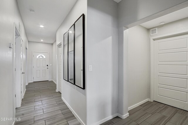 13804 Flora Vista Ave, Horizon City, TX 79928 - hallway featuring baseboards, recessed lighting, and wood tiled floors
