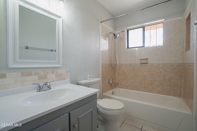 1662 Gene Torres Dr, El Paso, TX 79936 - bathroom featuring toilet, vanity, tub / shower combination, tile patterned floors, and backsplash