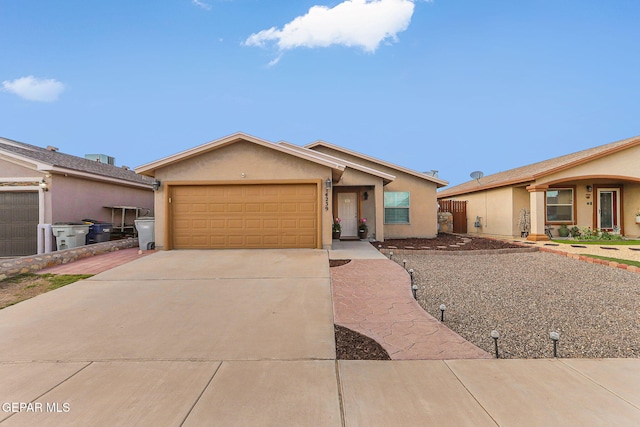 14239 Trigger Rock Ln, El Paso, TX 79938 - ranch-style house with a garage, driveway, and stucco siding