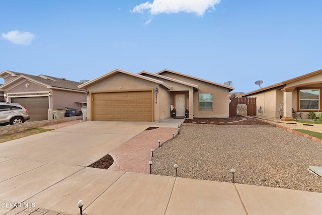14239 Trigger Rock Ln, El Paso, TX 79938 - ranch-style house featuring a garage, driveway, stucco siding, and fence