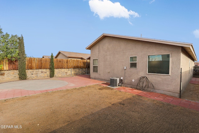 14239 Trigger Rock Ln, El Paso, TX 79938 - rear view of house featuring a patio, a fenced backyard, stucco siding, and cooling unit