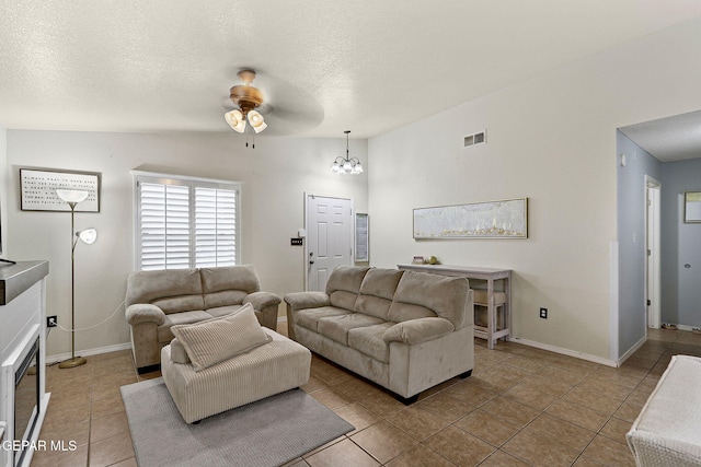 14239 Trigger Rock Ln, El Paso, TX 79938 - living area featuring tile patterned flooring, ceiling fan, a textured ceiling, a chandelier, and baseboards