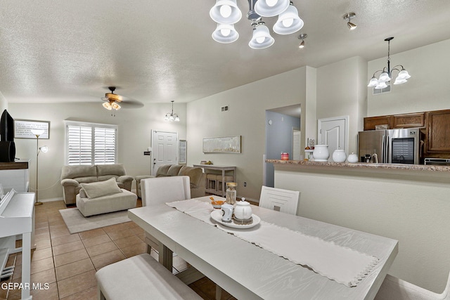 14239 Trigger Rock Ln, El Paso, TX 79938 - dining room with a chandelier, a textured ceiling, light tile patterned flooring, ceiling fan, and baseboards