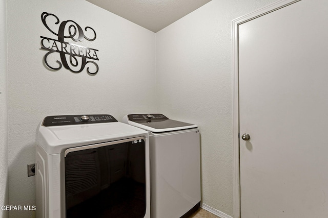 14239 Trigger Rock Ln, El Paso, TX 79938 - clothes washing area featuring washer and clothes dryer
