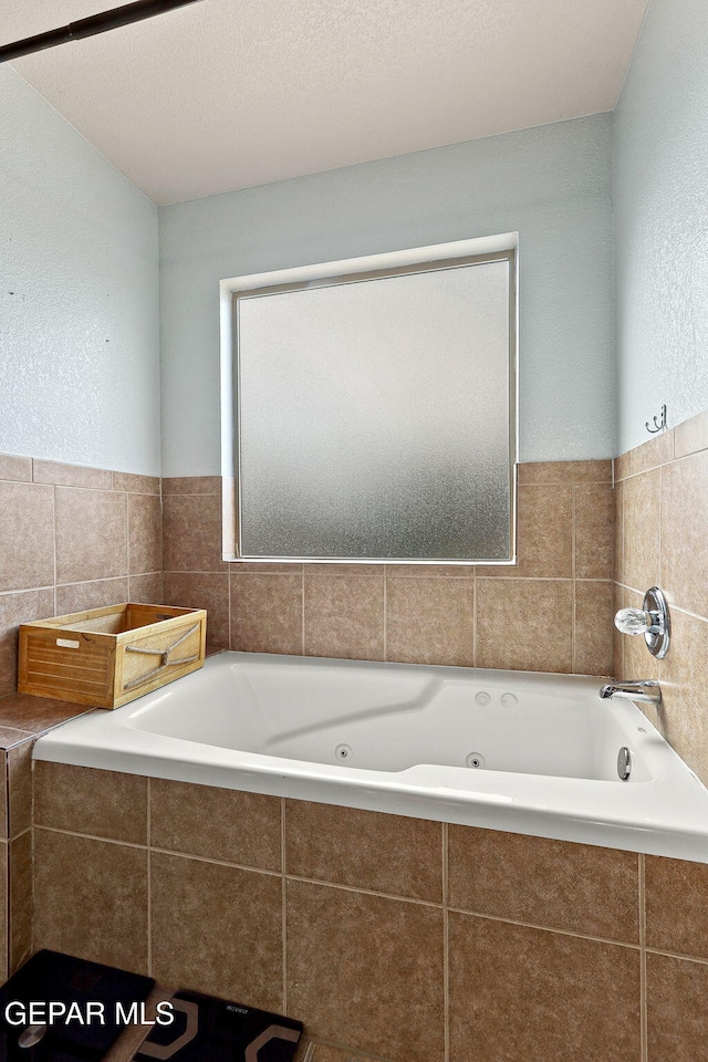 14239 Trigger Rock Ln, El Paso, TX 79938 - bathroom featuring a jetted tub