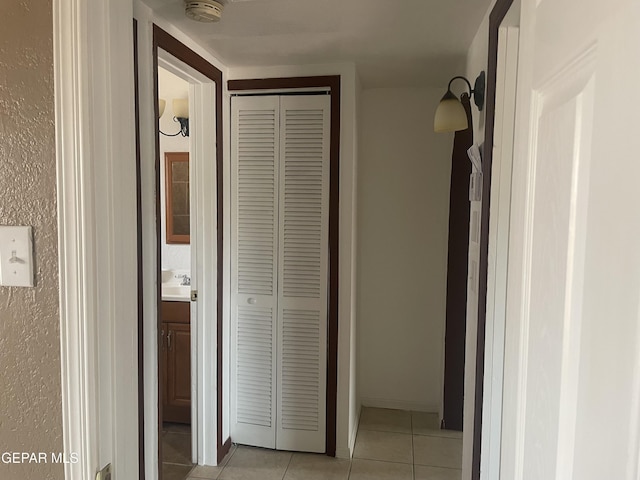 8324 Diana Dr, El Paso, TX 79904 - corridor with light tile patterned floors and a sink