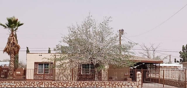 8324 Diana Dr, El Paso, TX 79904 - view of front of house featuring a fenced front yard, a gate, and stucco siding
